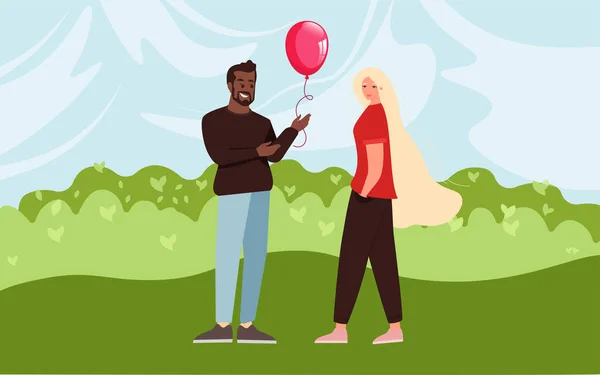 Mutlu genç çift. Adamın elinde bir balon var..