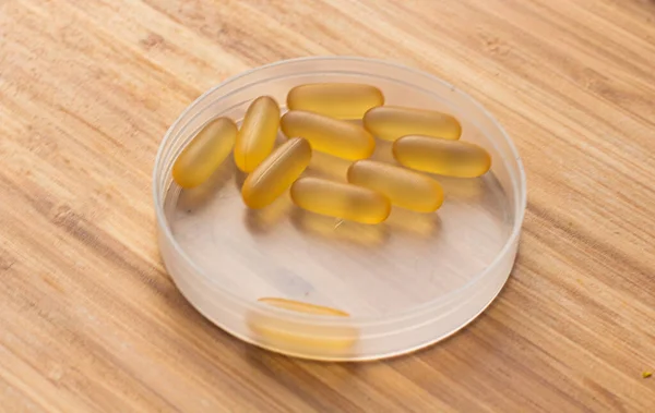 Omega 3 gel capsules on the wooden table — Stock Photo, Image