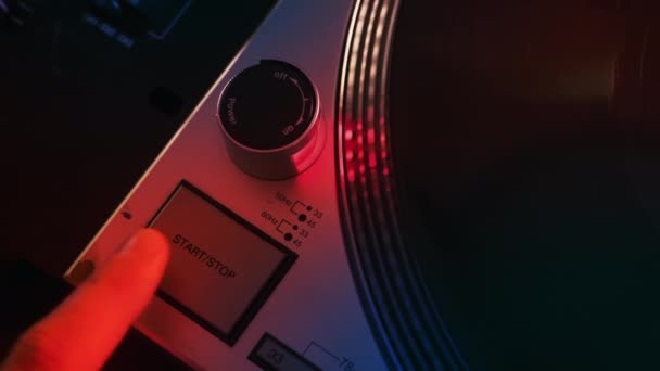 Man Starting Record Player Pushing Start Button Neon Red Illumination — Stock Video