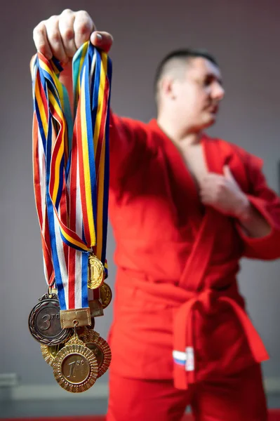 Martial Arts Fighter Red Kimono Posing Holding Bunch Medals His — Stock Photo, Image