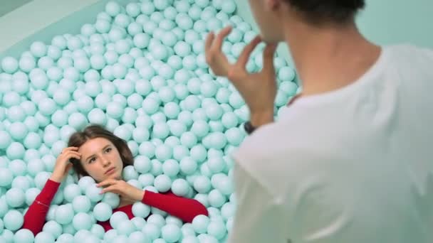 Photographer Taking Shots Young Woman Red Dress Lying Posing Pile — Stock Video