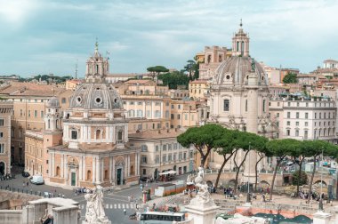 ROME, ITALY - JUNE, 2022: View of the Piazza Venezia from the Victor Emmanuel II Monument located in the centre of the city. Multiple people, cars and old classic buildings