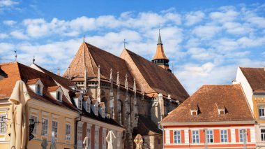 View of The Council Square in old centre of Brasov, Romania. Classic buildings in front of The Black Church