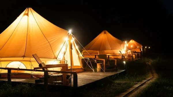 Tents Burning Torches Lamps Wooden Chairs Glamping Night — Photo
