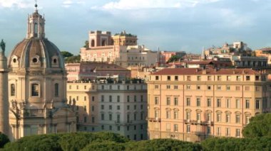 Street scape of the ancient centre of Rome, Italy. Santa Maria di Loreto and Trajan Column, greenery and old buildings