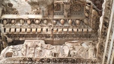 Close view of a the facade of an ancient building with stucco and sculptures in Rome, Italy
