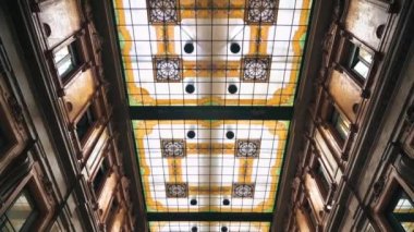 ROME, ITALY - JUNE, 2022: Interior of a mall with shops made in classic style, people