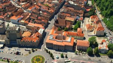 Aerial drone view of Brasov, Romania. Old city centre with Museum of History, Black church, buildings, people