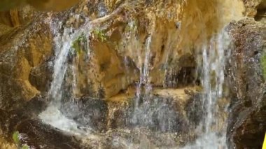 View of The Ialomitei Cave in Bucegi Mountains, Romania. Water spring