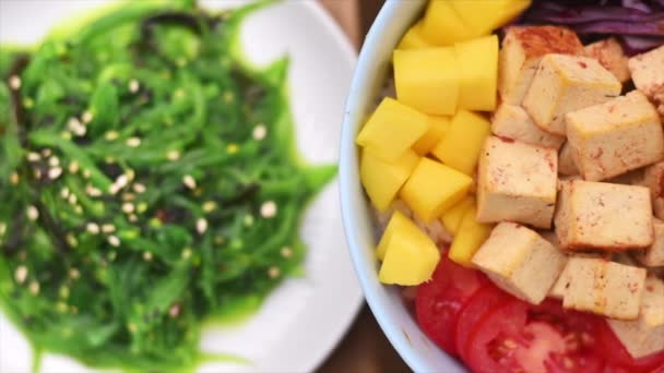 Close View Vegan Poke Vegetables Tofu Bowl Seaweed Nearby — Stockvideo