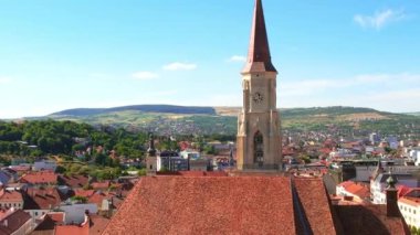 Aerial drone view of Saint Michael Church in Cluj, Romania. Cityscape, central square, old buildings