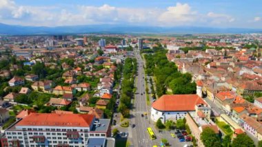 Aerial drone view of Sibiu, Romania. Roads with greenery, and residential buildings