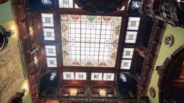 Peles Castle interior in Romania. A room with a classic design, ceiling with stained glass window