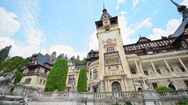 View of The Peles Castle in Romania. Castle with gardens and statues