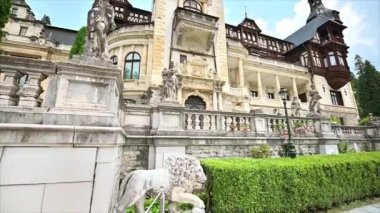 View of The Peles Castle in Romania. Castle with gardens and statues