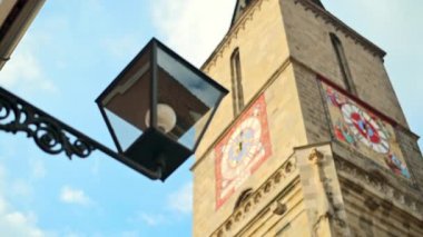Close view of the Black Church facade and a lamp post in old Brasov centre, Romania