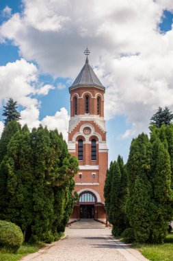 Vertical view of the Episcopal Church in Curtea de Arges Monastery in Romania. Gardens around