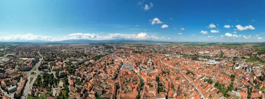 Aerial drone panoramic view of the Historic Centre of Sibiu, Romania. The Great Square with Sibiu Lutheran Cathedral and old buildings around, narrow streets