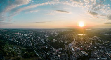 Aerial drone view of Chisinau downtown at sunset. Roads, parks, greenery, multiple buildings. Moldova