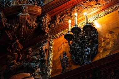 Peles Castle interior in Romania. A room with a classic design and multiple wooden details