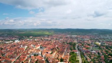 Aerial drone view of Cluj centre, Romania. Cityscape, roads with cars, old buildings, Saint Michael Church