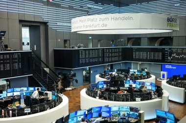 FRANKFURT, GERMANY - SEPTEMBER, 2022: Close view of the main office with multiple screens and workers in the german stock exchange clipart