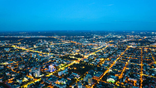 Aerial drone view of Chisinau at evening, Moldova. View of city with multiple buildings, roads and illumination
