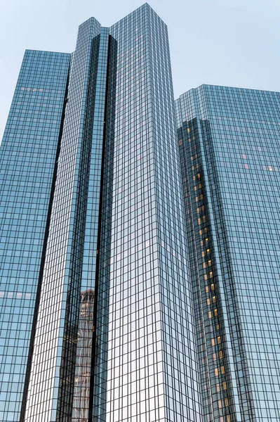 Bottom-up vertical view of a skyscraper in Frankfurt downtown, Germany.