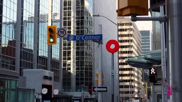 Cityscape view with skyscrapers, crossroad and traffic lights in downtown of Ottawa, Canada. — Stock video