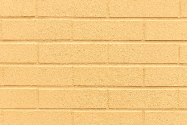 Light yellow color brick painted wall textured background — 图库照片