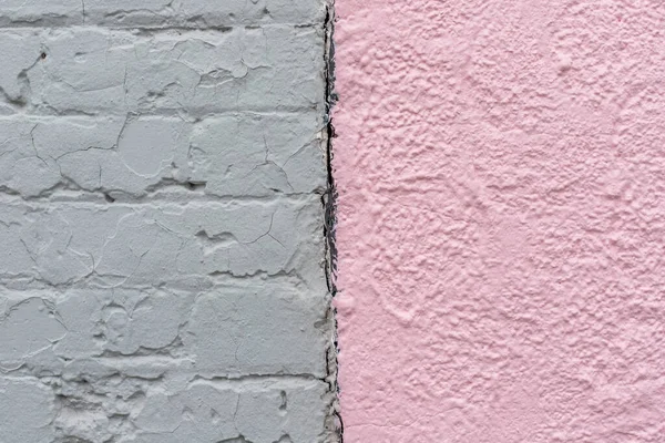 Light pastel pink stone and grey brick painted wall texture background close-up. — Stockfoto