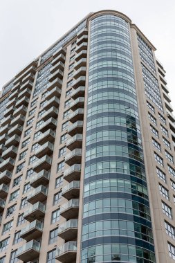 Tall apartment building in downtown Ottawa, Canada. Skyscraper against sky.