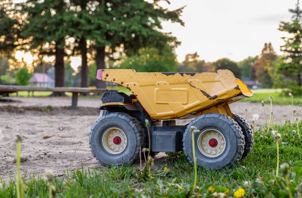 Old toy truck abandoned in the park playground — Stock Photo, Image