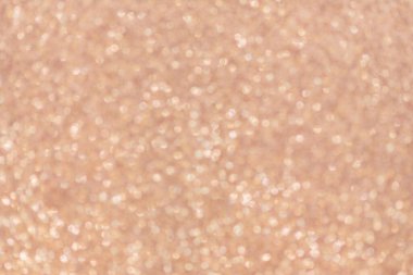 Pembe parlak, altın renginde, odaklanmış ışık arkaplanı. Noel ışıkları bokeh.