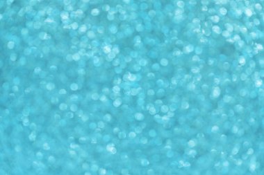 Mavi parlayan odaklanmış ışık arkaplanı