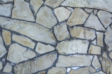 Taştan arka plan duvarı. Duvar kağıdı büyük kaldırım taşları.