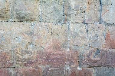 Background wall of stone. Wallpaper large cobblestones.