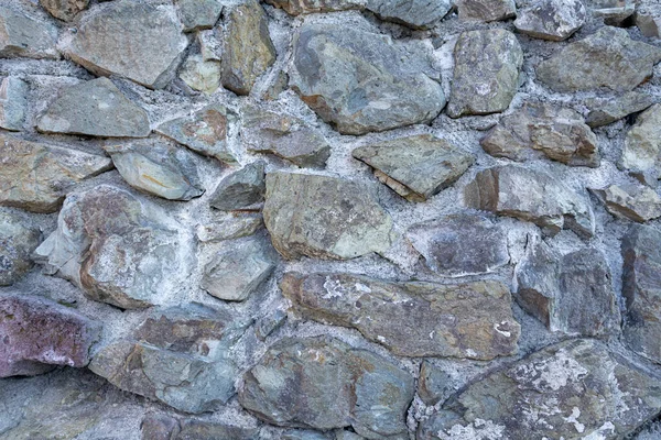 Taştan arka plan duvarı. Duvar kağıdı büyük kaldırım taşları.