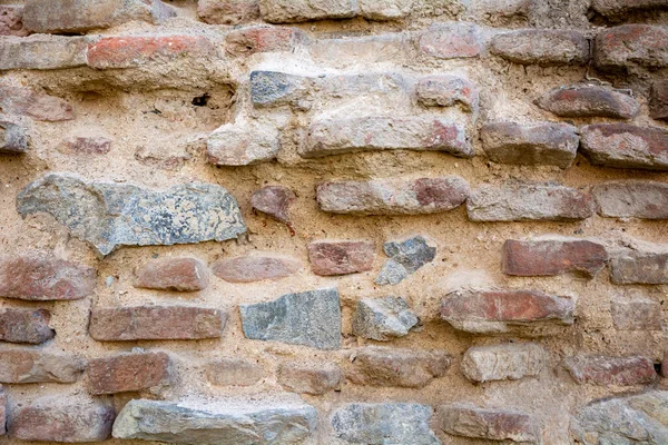 Background wall of red bricks. Wallpaper, texture of shabby bricks.