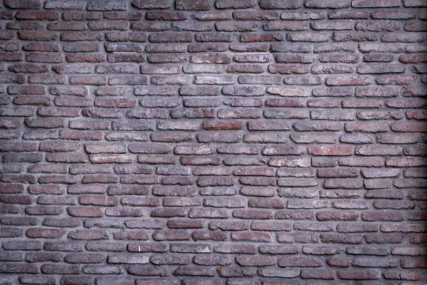 Background wall of red bricks. Wallpaper, texture of shabby bricks.