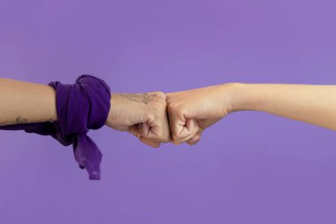 Womans hand with signs on purple background with paleacate or bandana of womens day. clipart