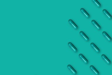 Kapsül desenli yeşil arkaplan.