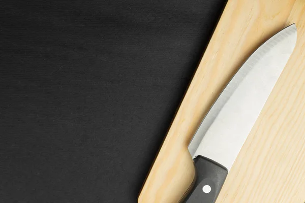 Knife with minimalist cutting board. High quality photo