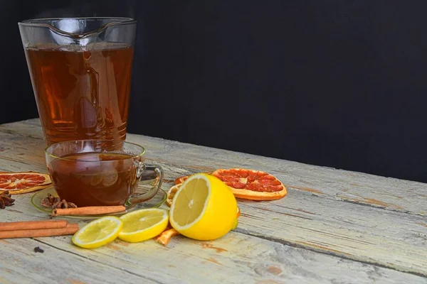 Warm Cup Tea Glass Jug Wooden Rustic Table Cinnamon Sticks — Stockfoto