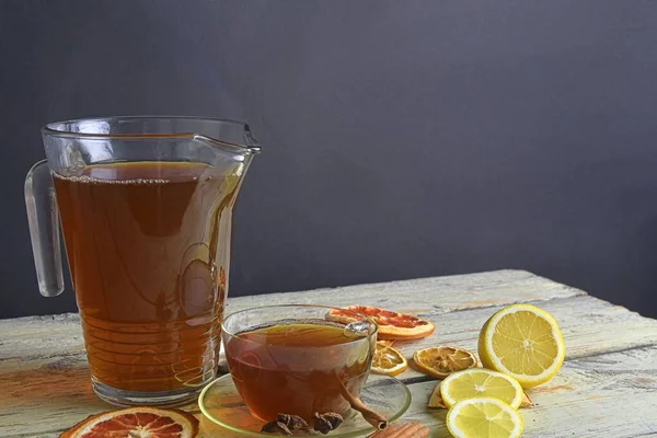 Warm Cup Tea Glass Jug Wooden Rustic Table Cinnamon Sticks — Stock Photo, Image