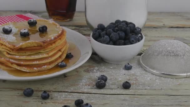 Stack of american buttermilk pancakes with berries and maple syrup. Tasty sweet breakfast food. Pancakes on white rustic background — Stock Video