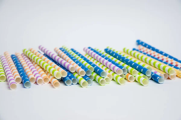 Colorful helical or striped paper straws isolated on white background including clipping path.