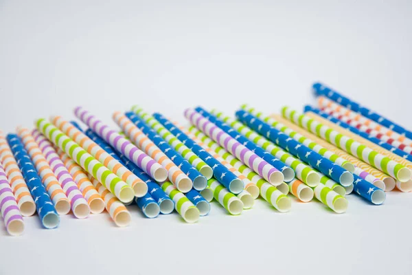 Colorful helical or striped paper straws isolated on white background including clipping path.