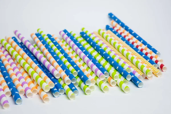 Colorful helical or striped paper straws isolated on white background including clipping path.