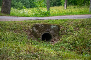 Concrete culvert with wing walls under a park road